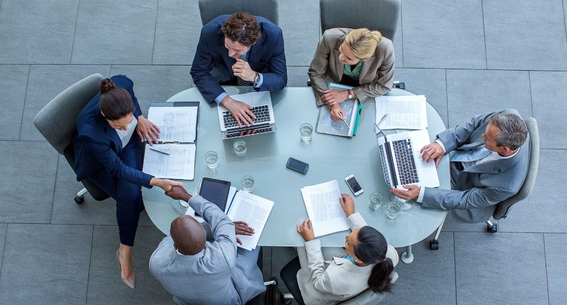 Boardroom members around a table